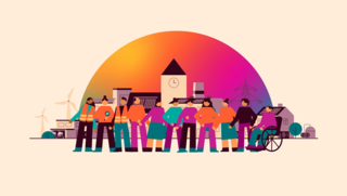 Gruppe von Menschen in bunter Kleidung vor Häusern und Windrädern, darunter eine Person im Rollstuhl