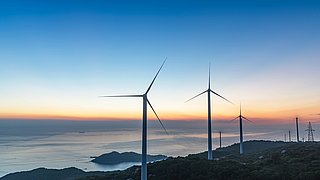 Wind,Turbines,On,The,Coast,In,The,Production,Of,Green